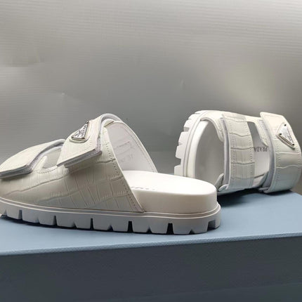 PRADA 26S STRAP SLIDES IN IVORY WHITE CROC EMBOSSED CALFSKIN