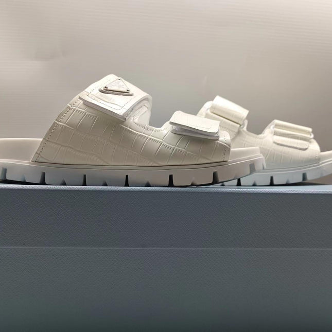 PRADA 26S STRAP SLIDES IN IVORY WHITE CROC EMBOSSED CALFSKIN