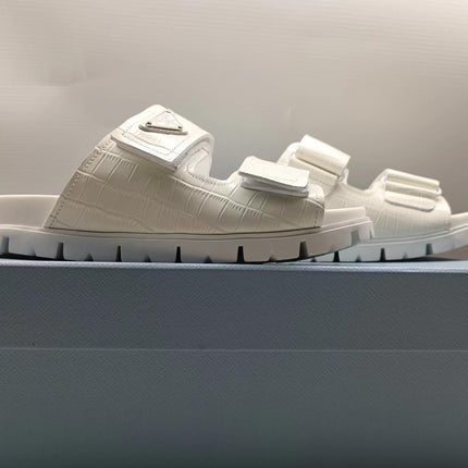 PRADA 26S STRAP SLIDES IN IVORY WHITE CROC EMBOSSED CALFSKIN