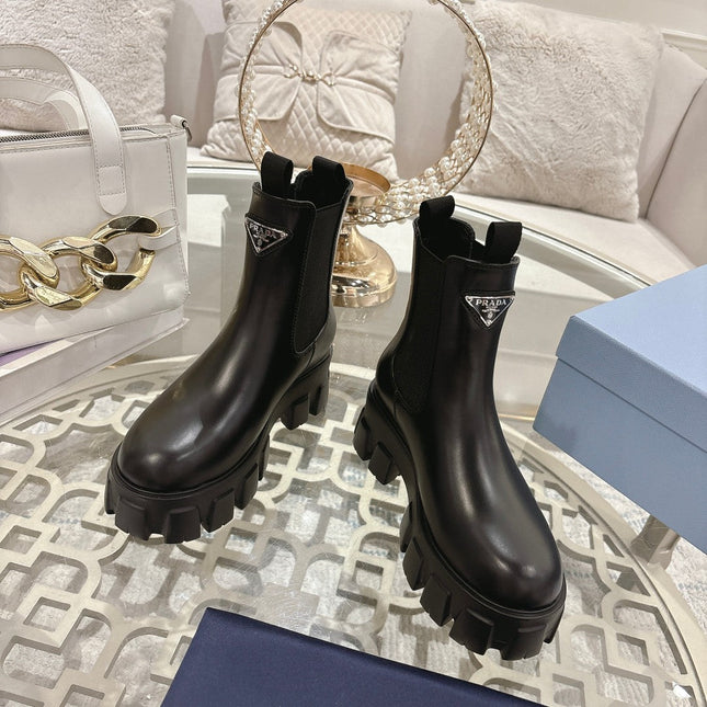 PRADA 26S MONOLITH CHELSEA BOOTS IN BLACK CALFSKIN AND FABRIC