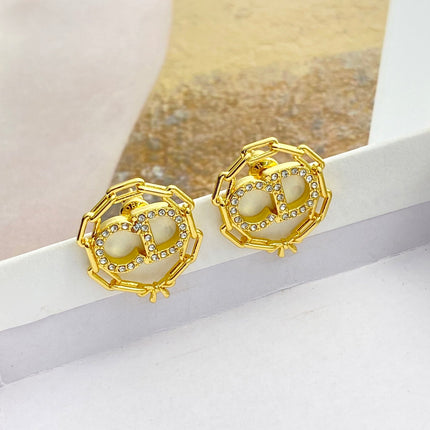 CD 26S CRYSTAL CHAIN LOGO STUD EARRINGS IN GOLD TONE METAL 645655