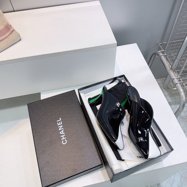 CHANEL 26S HIGH-HEEL MULES 70 MM IN BLACK AND WHITE LAMBSKIN
