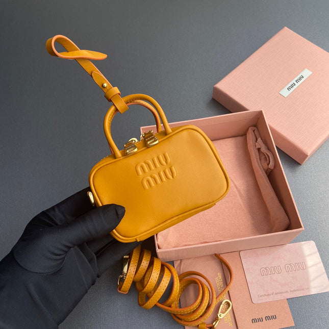 MICRO BAG KEYCHAIN 11  IN INDOCHINE ORANGE CALFSKIN EMBOSSED LOGO