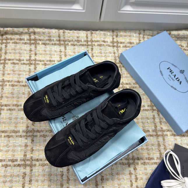 PRADA 26S LOW TOP SNEAKERS IN BLACK NYLON AND SUEDE