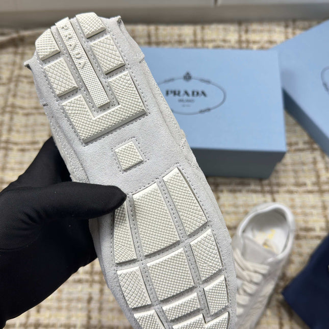 PRADA 26S LOW TOP SNEAKERS IN WHITE NYLON AND SUEDE