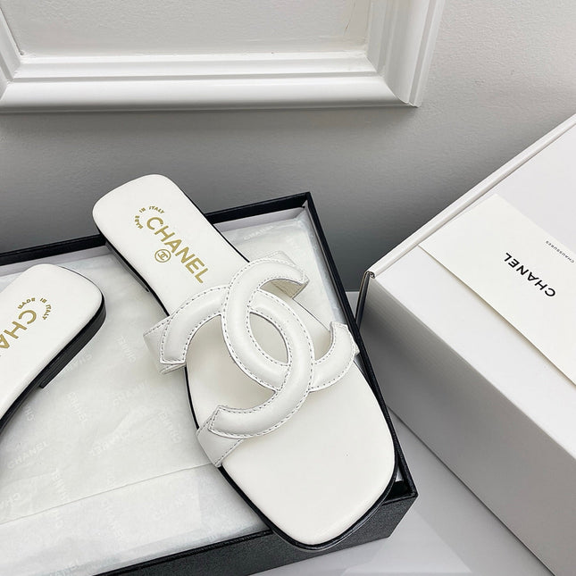 CHANEL CC LOGO MULES IN WHITE CALFSKIN