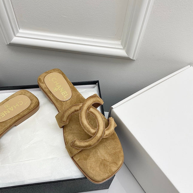 CHANEL CC LOGO MULES IN DARK BEIGE SUEDE
