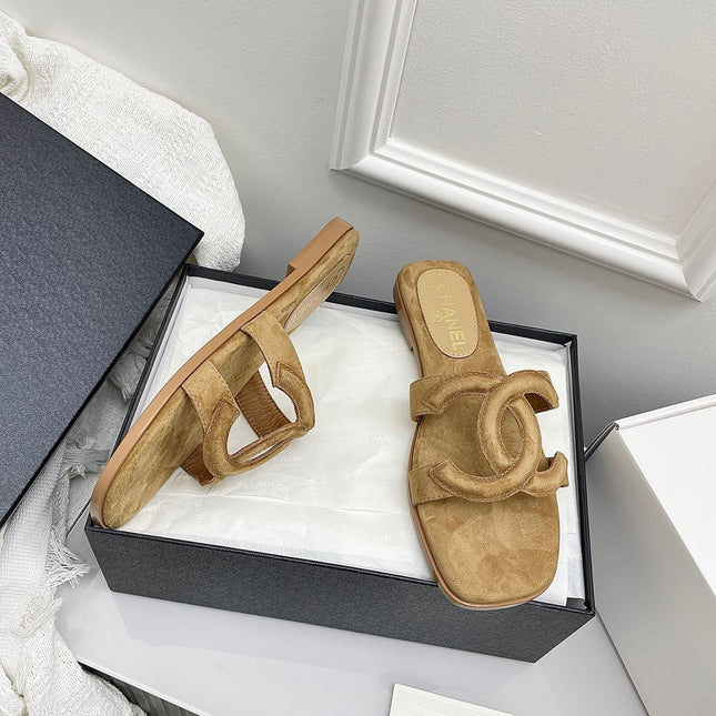CHANEL CC LOGO MULES IN DARK BEIGE SUEDE