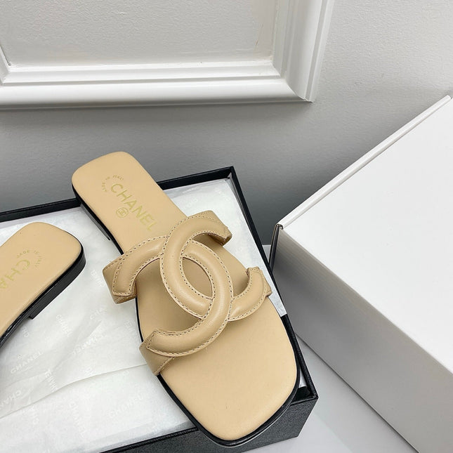 CHANEL CC LOGO MULES IN BEIGE CALFSKIN
