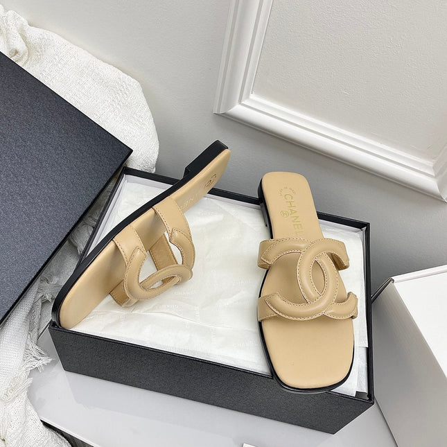 CHANEL CC LOGO MULES IN BEIGE CALFSKIN