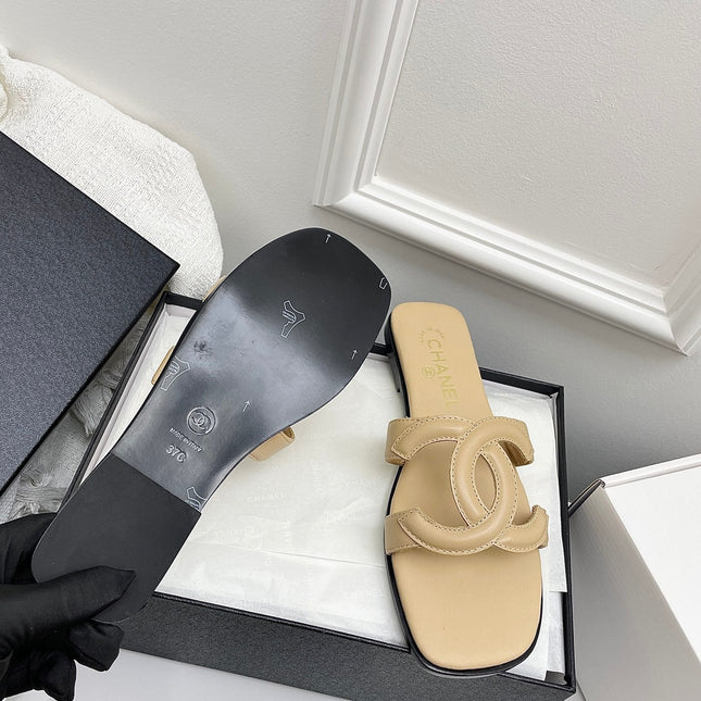 CHANEL CC LOGO MULES IN BEIGE CALFSKIN