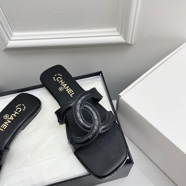 CHANEL CC LOGO MULES IN BLACK CALFSKIN