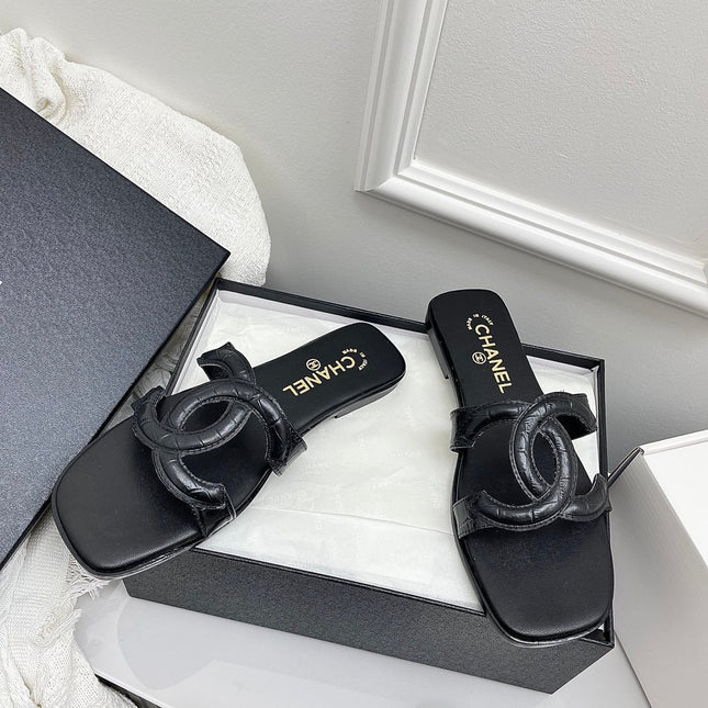 CHANEL CC LOGO MULES IN BLACK CALFSKIN