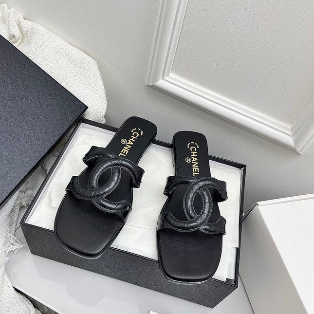 CHANEL CC LOGO MULES IN BLACK CALFSKIN