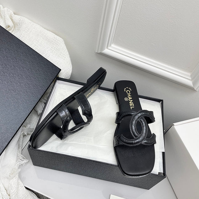 CHANEL CC LOGO MULES IN BLACK CALFSKIN