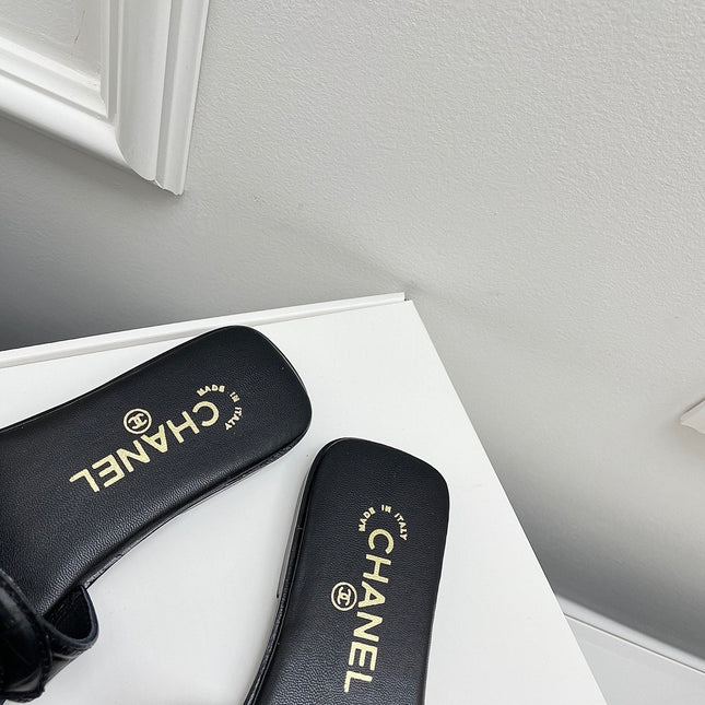 CHANEL CC LOGO MULES IN BLACK CALFSKIN