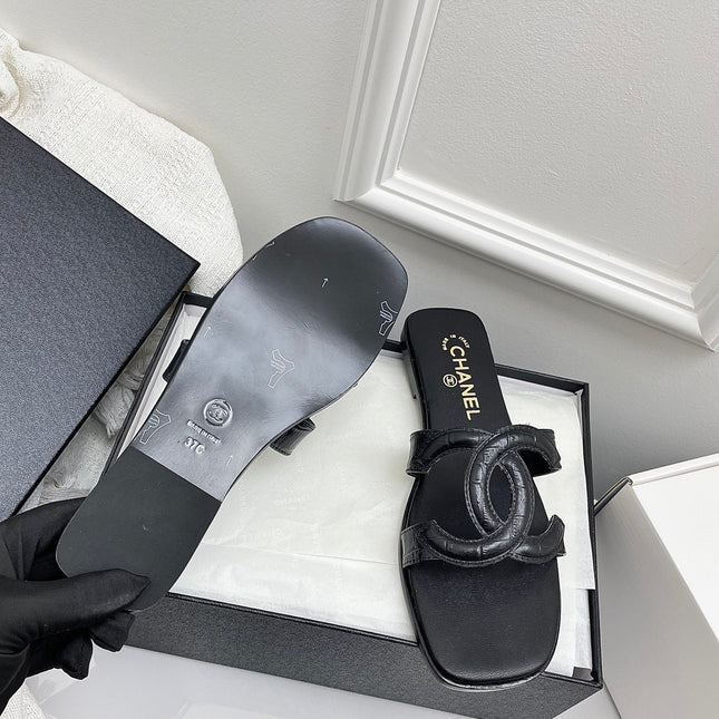 CHANEL CC LOGO MULES IN BLACK CALFSKIN