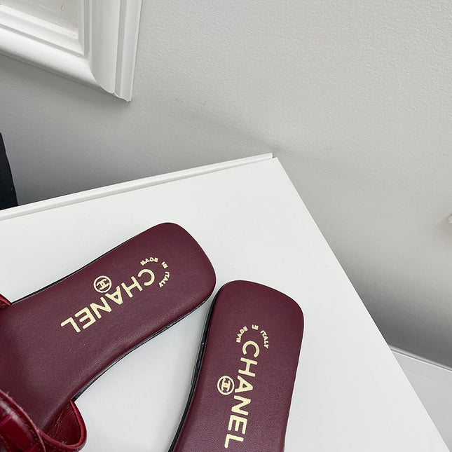 CHANEL CC LOGO MULES IN BURGUNDY CALFSKIN