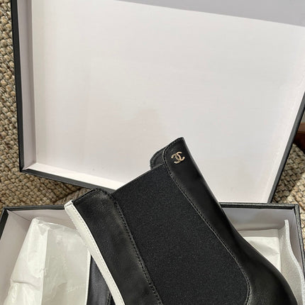 CHANEL 26S ANKLE BOOTS IN BLACK CALFSKIN WITH WHITE TRIM
