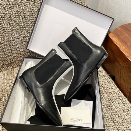 CHANEL 26S ANKLE BOOTS IN BLACK CALFSKIN WITH WHITE TRIM
