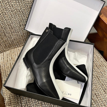 CHANEL 26S ANKLE BOOTS IN BLACK CALFSKIN WITH WHITE TRIM