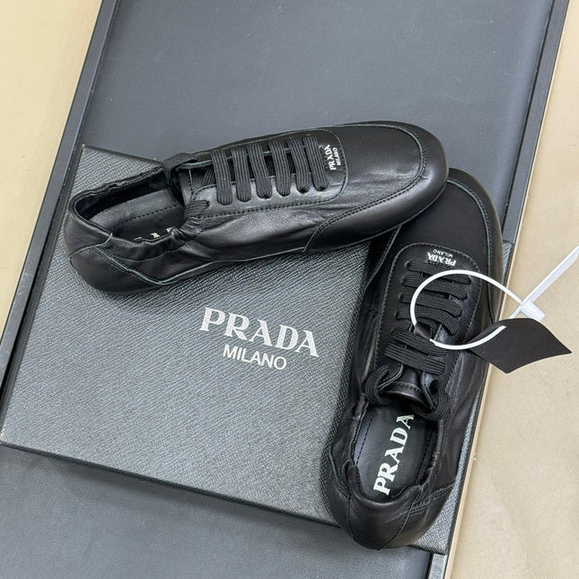 PRADA 25S COLLAPSE FLAT SHOES IN BLACK CALFSKIN