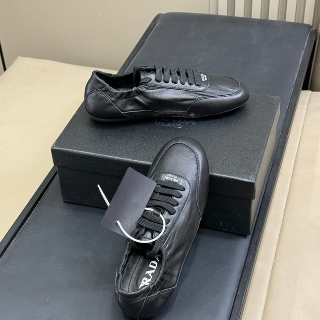 PRADA 25S COLLAPSE FLAT SHOES IN BLACK CALFSKIN