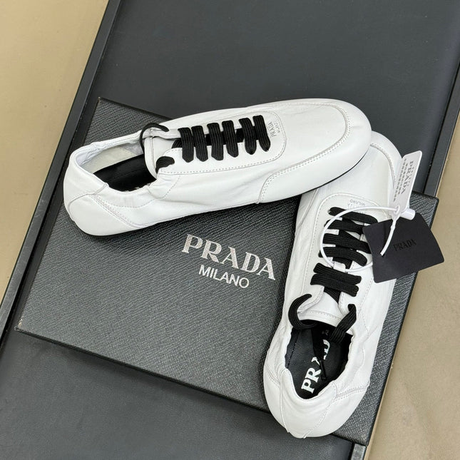 PRADA 25S COLLAPSE FLAT SHOES IN WHITE CALFSKIN