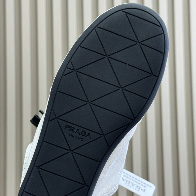 PRADA 25S COLLAPSE MULES IN WHITE CALFSKIN