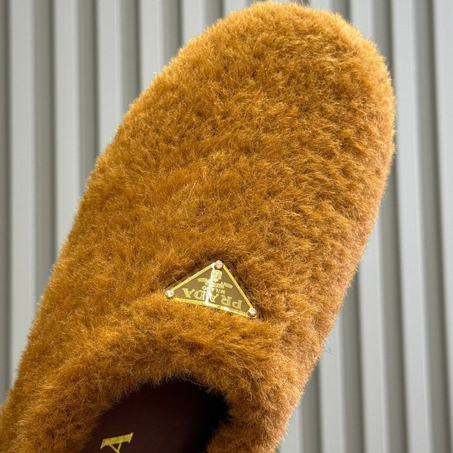 PRADA 25S CLOGS IN DARK ORANGE SHEARLING
