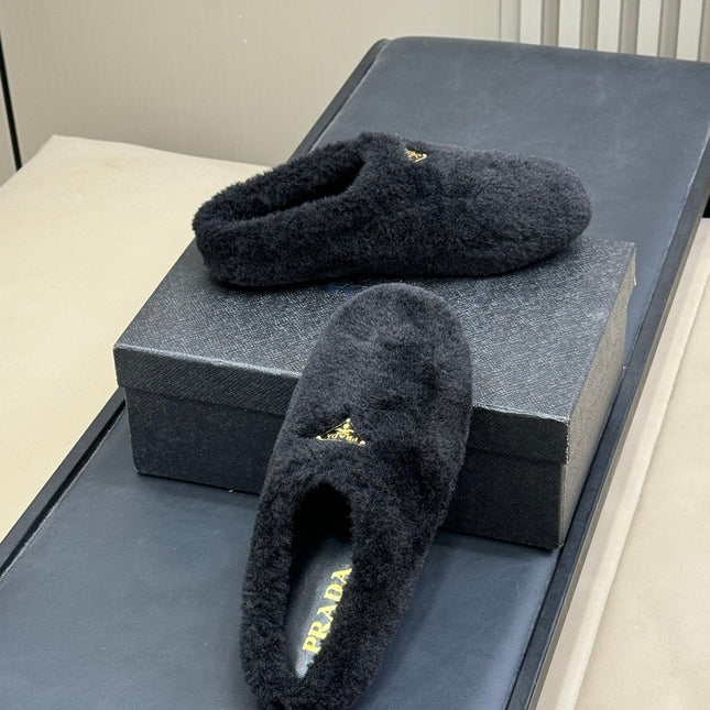 PRADA 25S CLOGS IN BLACK SHEARLING