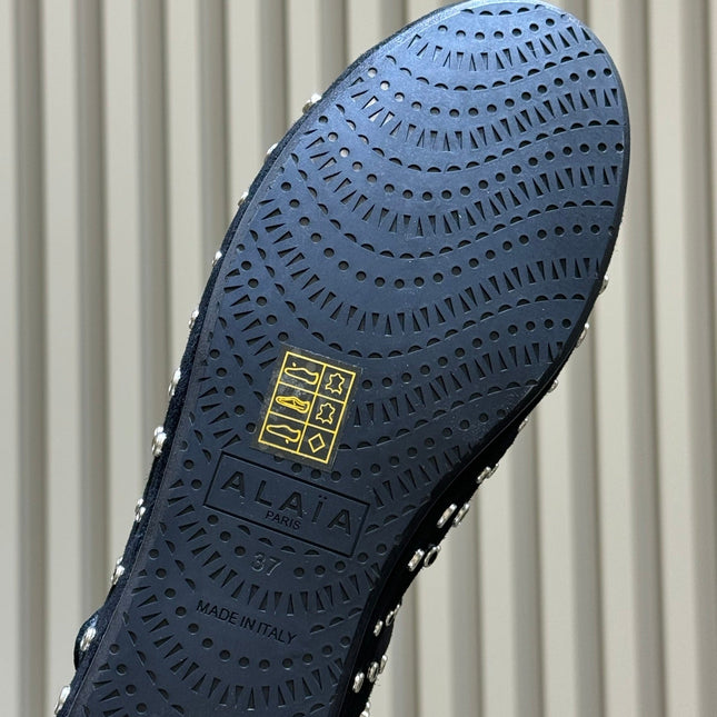 ALAIA 26S CROSS-STRAP FLATS IN BLACK SUEDE WITH SILVER HARDWARE