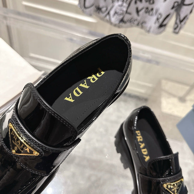 PRADA 26S PLATFORM LOAFERS 45MM IN BLACK PATENT CALFSKIN