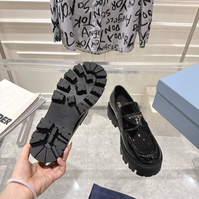 PRADA 26S PLATFORM LOAFERS 45MM IN BLACK PATENT CALFSKIN