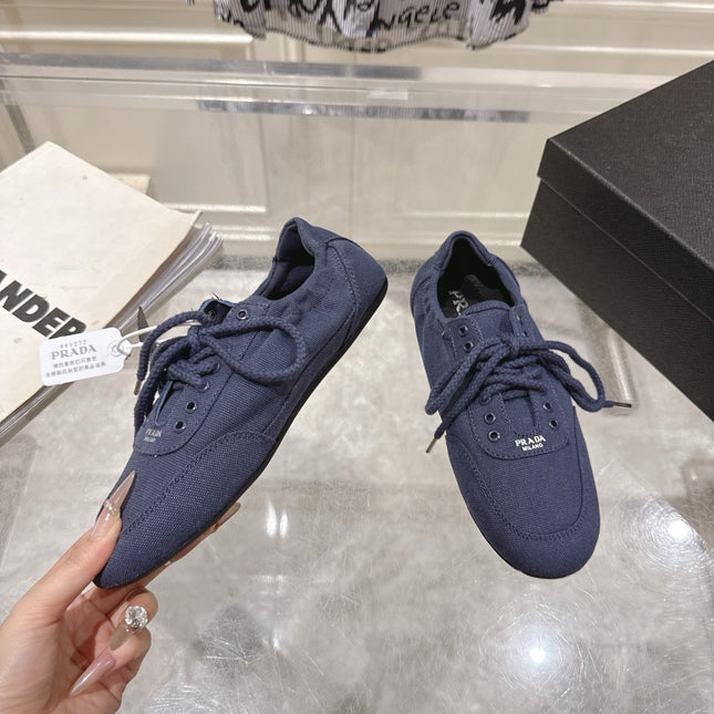 PRADA 26S COLLAPSE SNEAKERS IN BLUE CANVAS