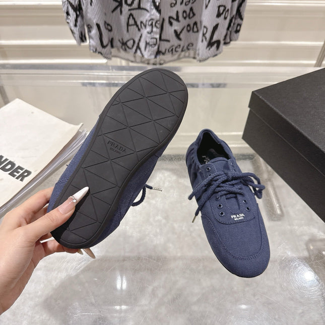 PRADA 26S COLLAPSE SNEAKERS IN BLUE CANVAS