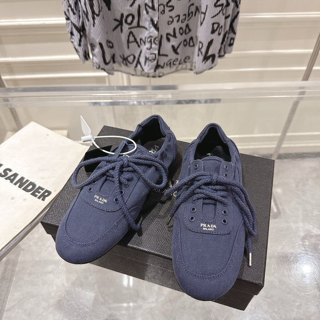 PRADA 26S COLLAPSE SNEAKERS IN BLUE CANVAS