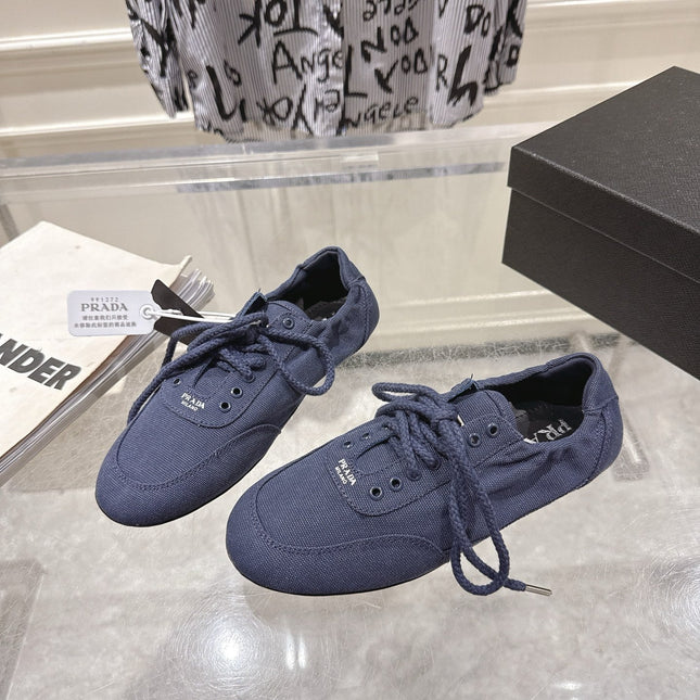 PRADA 26S COLLAPSE SNEAKERS IN BLUE CANVAS