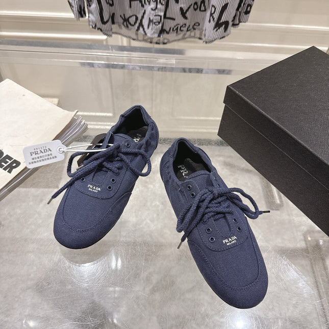 PRADA 26S COLLAPSE SNEAKERS IN BLUE CANVAS
