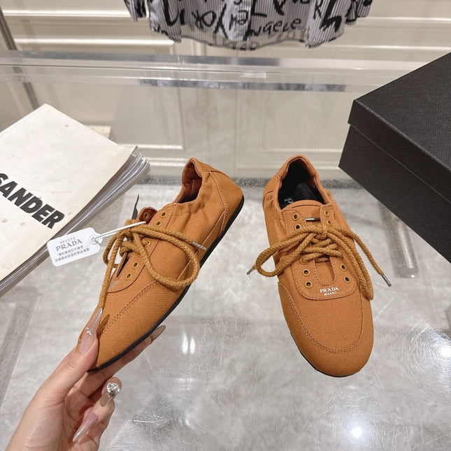 PRADA 26S COLLAPSE SNEAKERS IN CARAMEL BROWN CANVAS