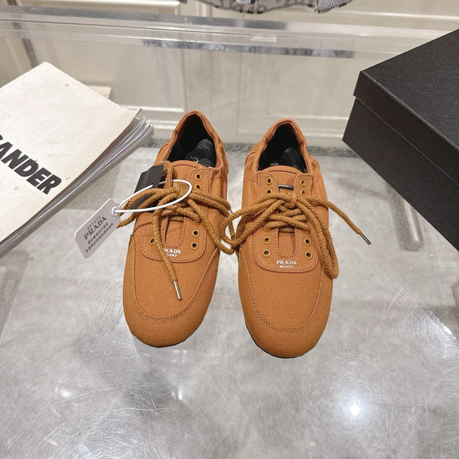 PRADA 26S COLLAPSE SNEAKERS IN CARAMEL BROWN CANVAS
