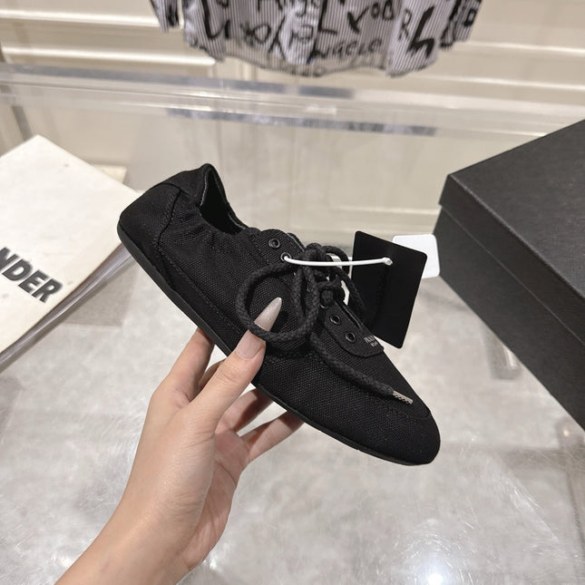 PRADA 26S COLLAPSE SNEAKERS IN BLACK CANVAS