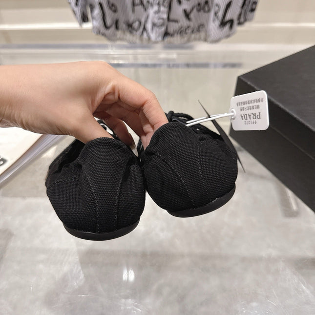 PRADA 26S COLLAPSE SNEAKERS IN BLACK CANVAS