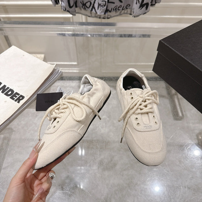 PRADA 26S COLLAPSE SNEAKERS IN WHITE CANVAS