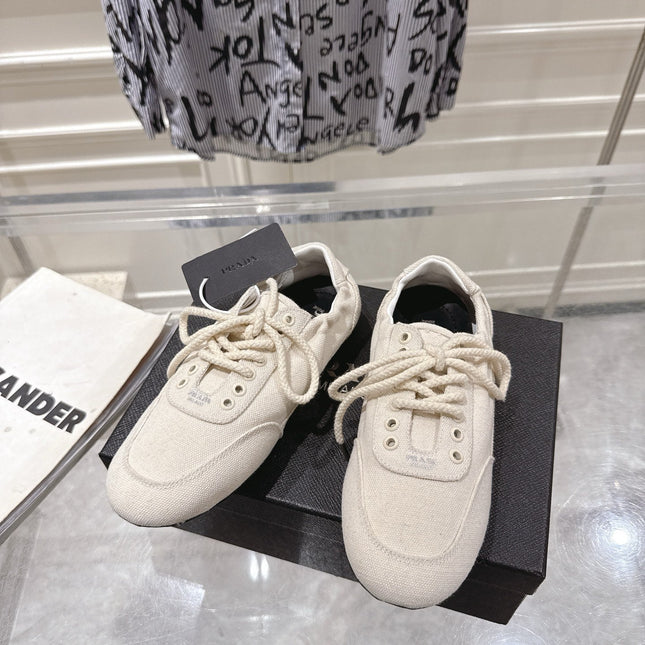 PRADA 26S COLLAPSE SNEAKERS IN WHITE CANVAS