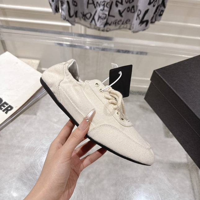 PRADA 26S COLLAPSE SNEAKERS IN WHITE CANVAS