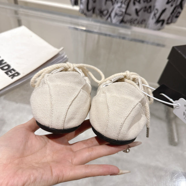 PRADA 26S COLLAPSE SNEAKERS IN WHITE CANVAS