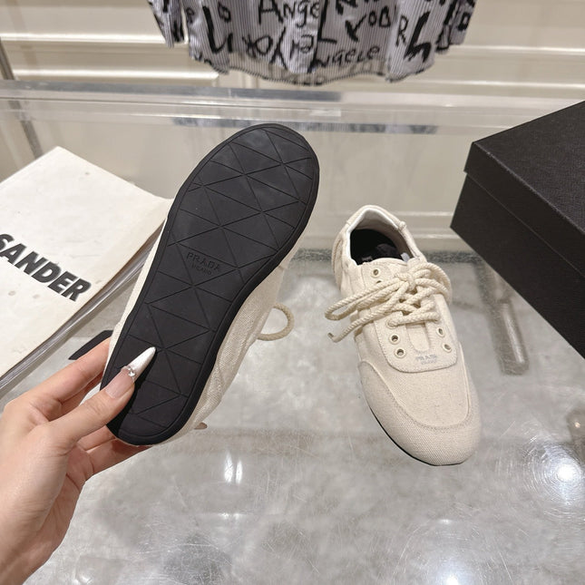 PRADA 26S COLLAPSE SNEAKERS IN WHITE CANVAS