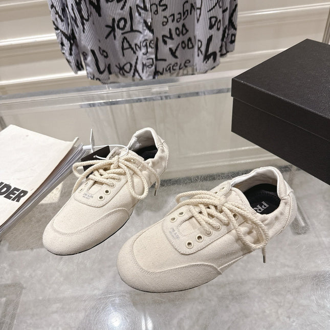 PRADA 26S COLLAPSE SNEAKERS IN WHITE CANVAS