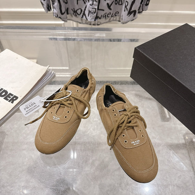 PRADA 26S COLLAPSE SNEAKERS IN BROWN CANVAS